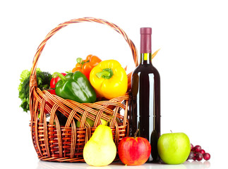vegetables and wine in a basket isolated on white
