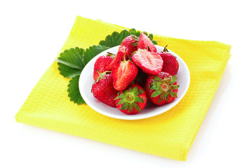 Many strawberries in plate isolated on white