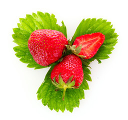 strawberry with green leaves isolated on white
