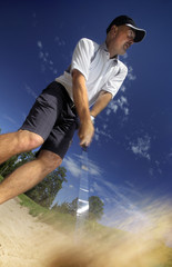 Fototapeta na wymiar golfer shooting a golf ball