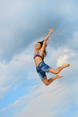 Obraz premium Beautiful Woman over blue Sky
