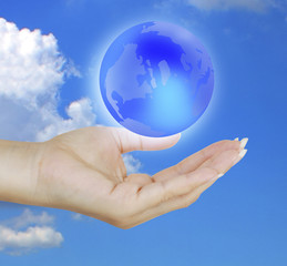 holding a glowing earth globe in his hands