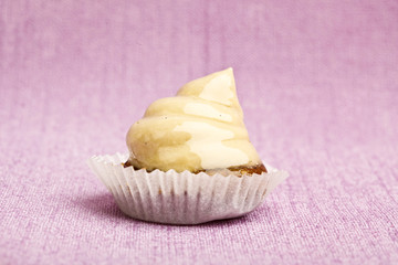 Beautiful little cake on colorful wallpaper background