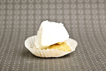 Beautiful little cake on colorful wallpaper background