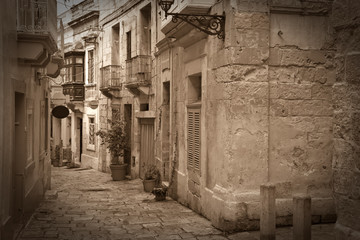 Retro photo of old narrow  street - obrazy, fototapety, plakaty