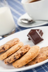 Peanut cookies with chocolate and cup of coffee or tea.