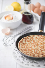 Freshly prepared crepes with maple syrup