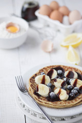 Freshly prepared crepes with banana & chocolate sauce