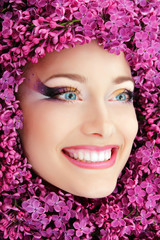 woman beautiful face with flower lilac