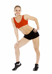 Smiling young sporty muscular woman.