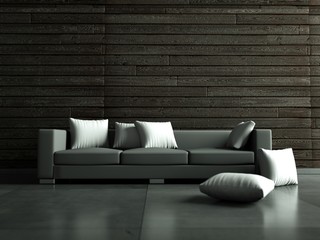 graues Sofa vor Holzwand