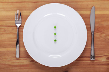 Peas on a white plate