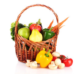 vegetables in a basket isolated on white