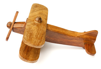 Old wooden toy airplane isolated on white background