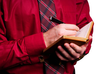 businessman with organizer in hands isolated on white