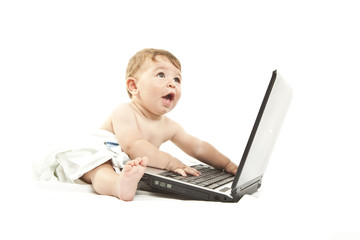 cute little baby using a pc