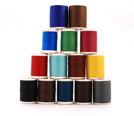 Spools of colour threads isolated on white