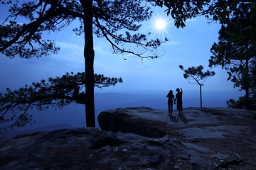 Silhouette of couple on tourists. When sunrise