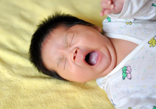 Asian baby yawning