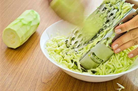 Hands Grating Zucchini