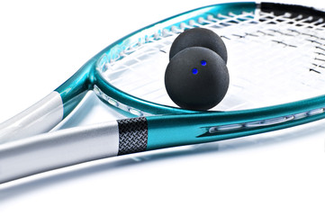 Blue squash racket with balls on white