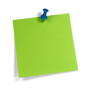 Grüner Merkzettel mit blauem Pin