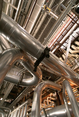 Equipment, cables and piping as found inside of a modern industr