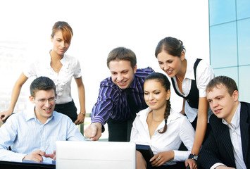 A group of young business persons working together