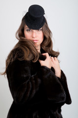 Fototapeta premium Beautiful Young Woman in Hat