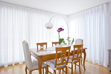 modern dining room with white curtains