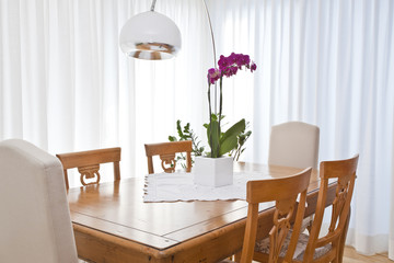 modern dining room with white curtains
