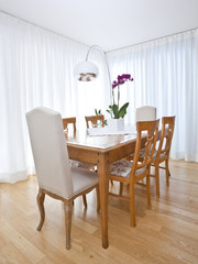 Fototapeta na wymiar modern dining room with white curtains