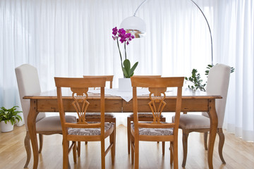 modern dining room with white curtains
