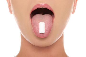 chewing gum in the tongue of woman
