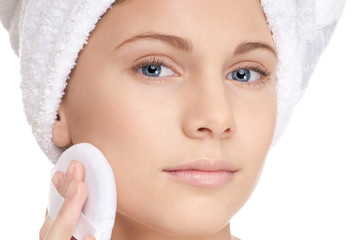 Closeup young beautiful girl with sponge