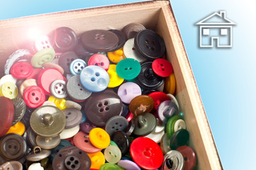 colorful buttons in a wooden box