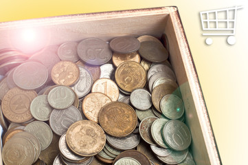 old coins in a wooden box