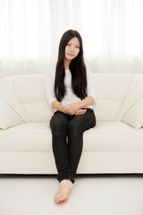 beautiful asian woman relaxing on the couch