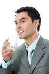 Portrait of smiling business man with glass of water, isolated