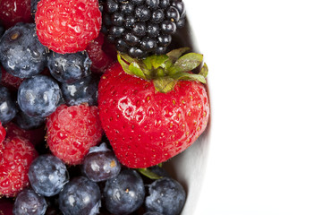 A group of fresh berries in a bowl