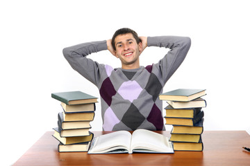 the guy is sitting among the books