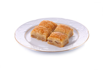 Turkish traditional dessert Baklava served in porcelain dish iso