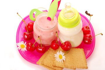 cherry yogurt and bottle of milk for baby