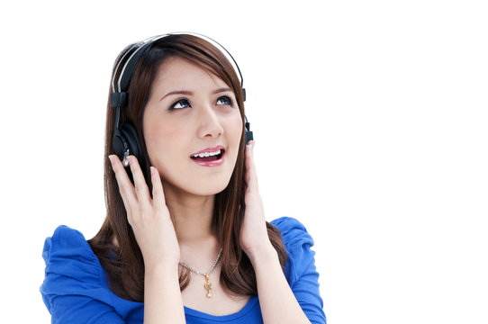 Cute young woman listening to music