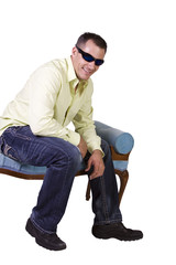 white man sitting on chair relaxed