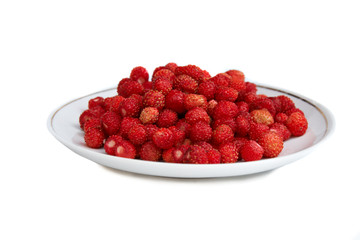 plate full of wild strawberries isolated on white