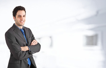 Fototapeta premium Young businessman smiling. Copyspace in the right side
