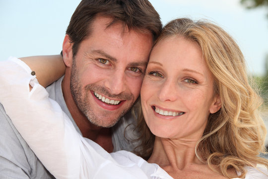 Couple Stood With Arms Around Each Other