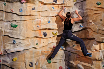 woman on rock wall