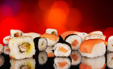 Delicious sushi on shiny blur background